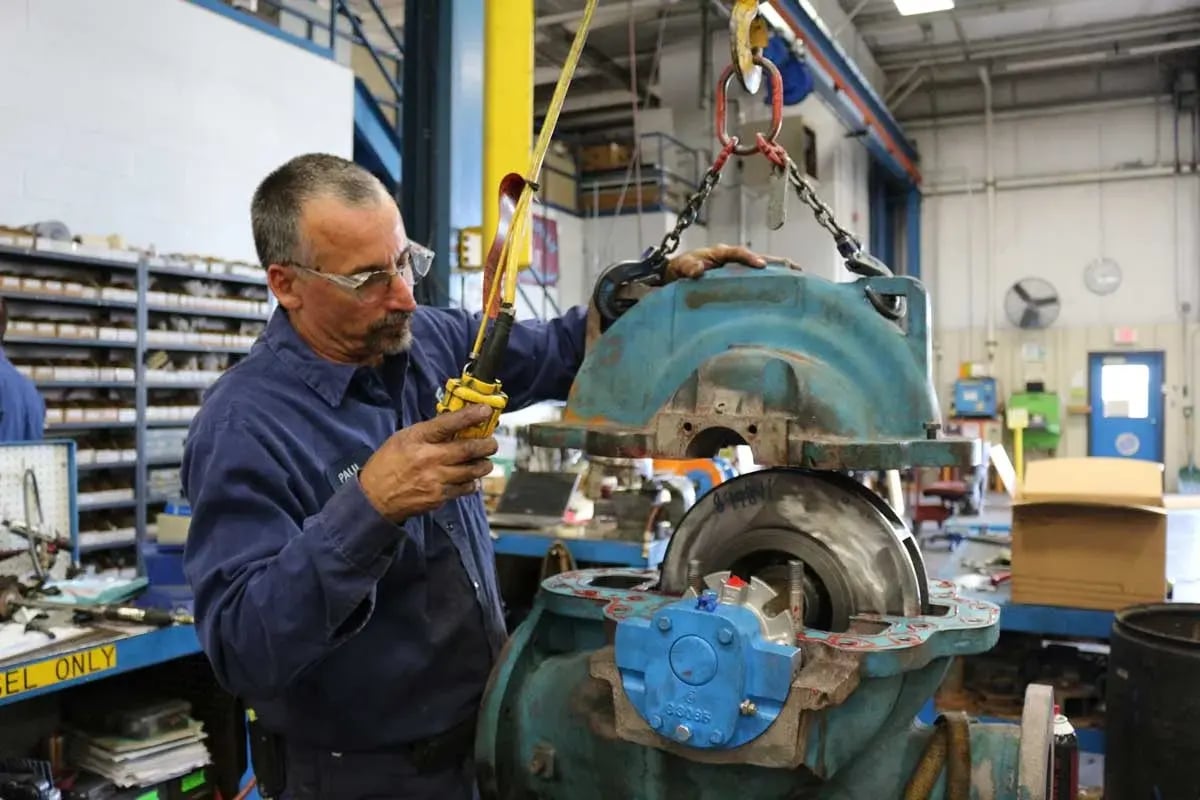 placing_cover_back_on_pump_after_rebuild (1)