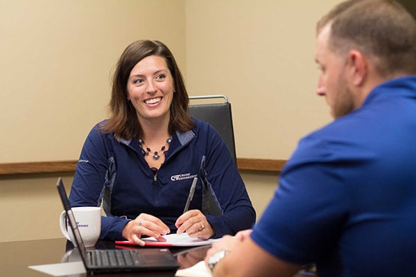 crane_employee_smiling_in_meeting